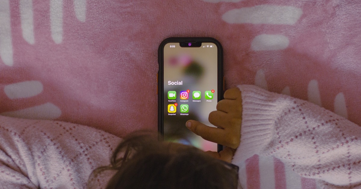 Person breaking free from phone chains, symbolizing overcoming screen time addiction